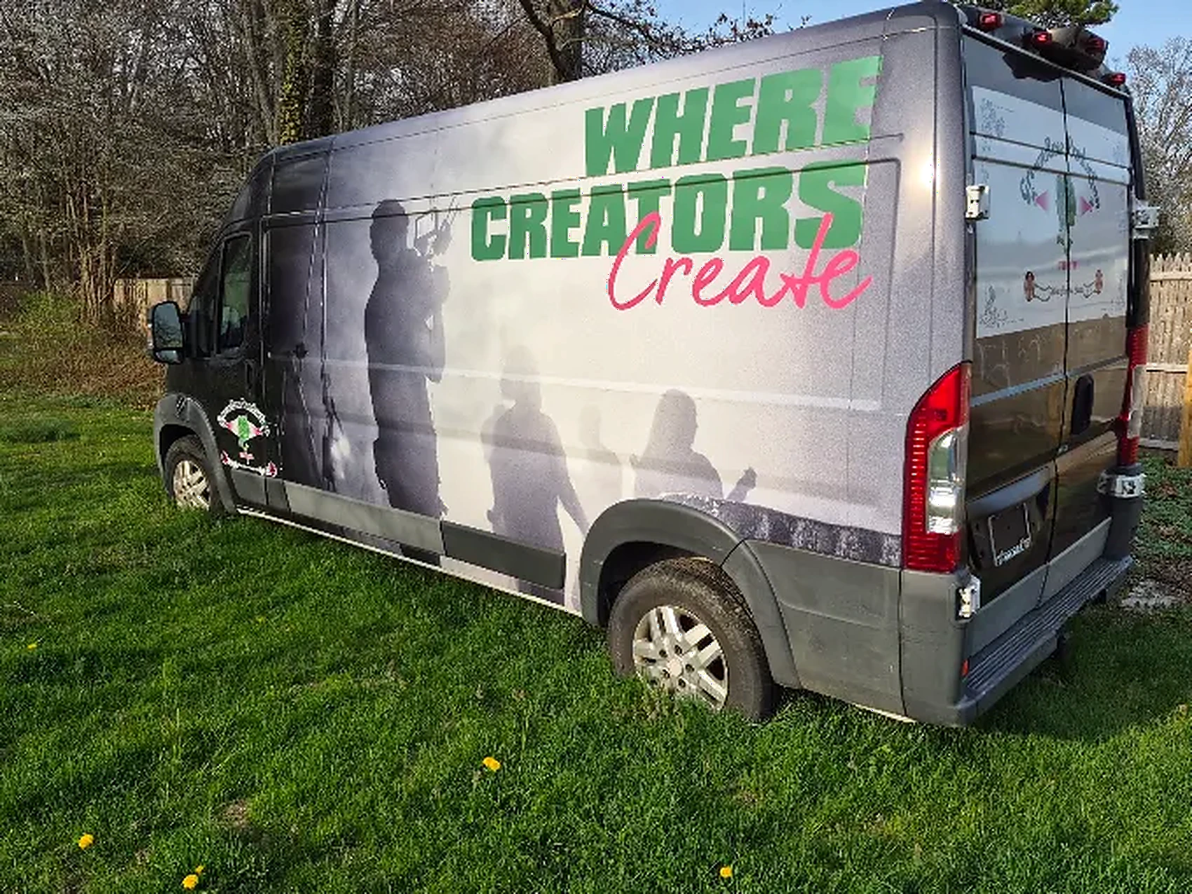 The GreenRose production van, wrapped with “Where Creators Create” artwork