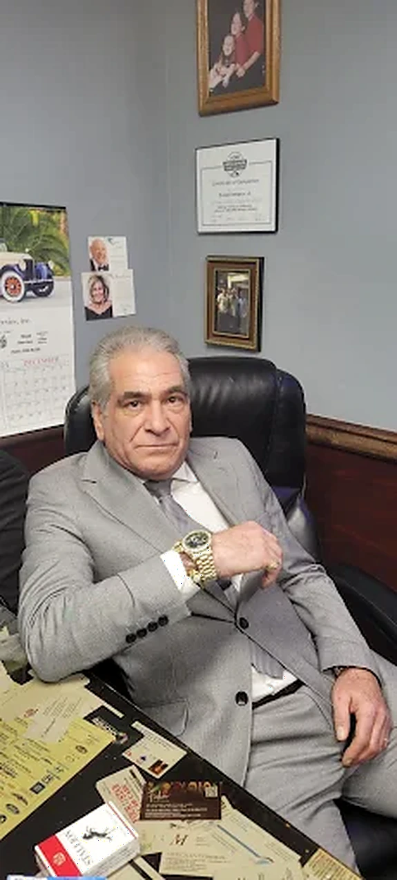Phil Green, founder of GreenRose Production Studios, at his office desk