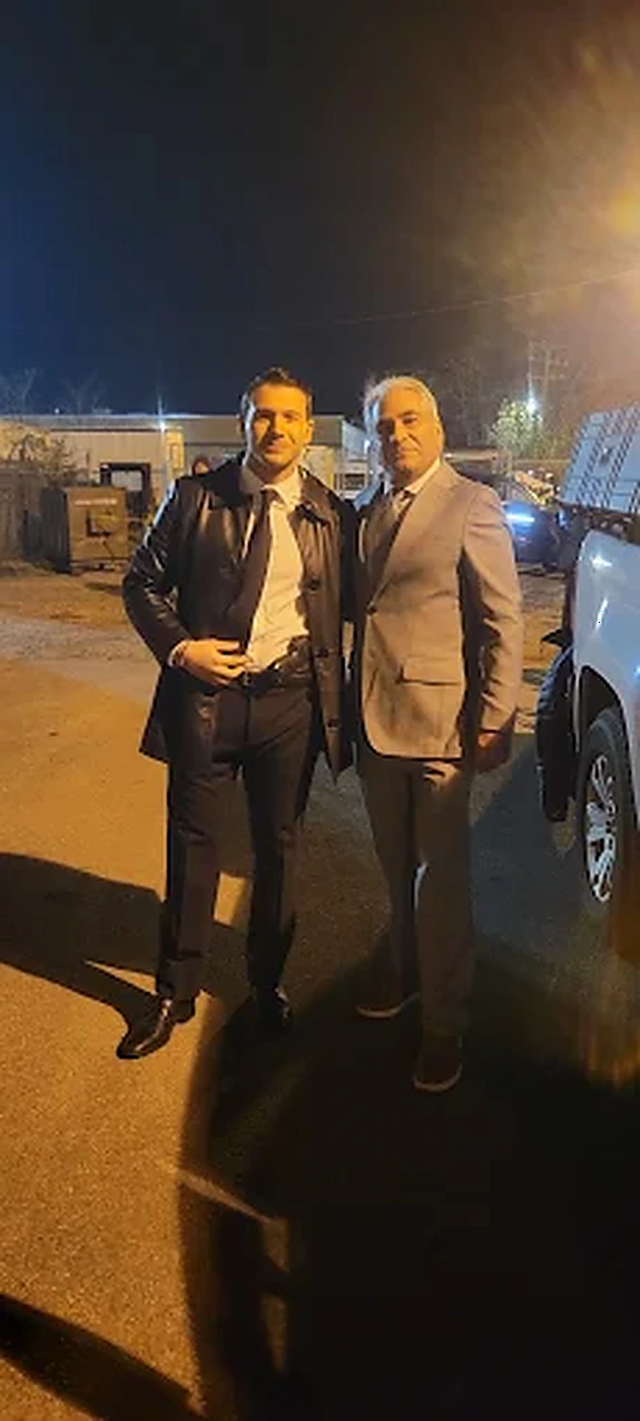 Phil Green with a collaborator on a night location shoot