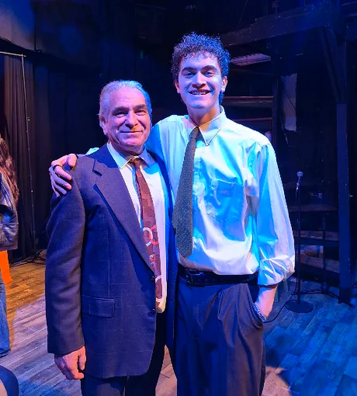 Phil Green with a cast member after a shoot